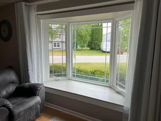 Clean interior bay window in a living room after residential window washing