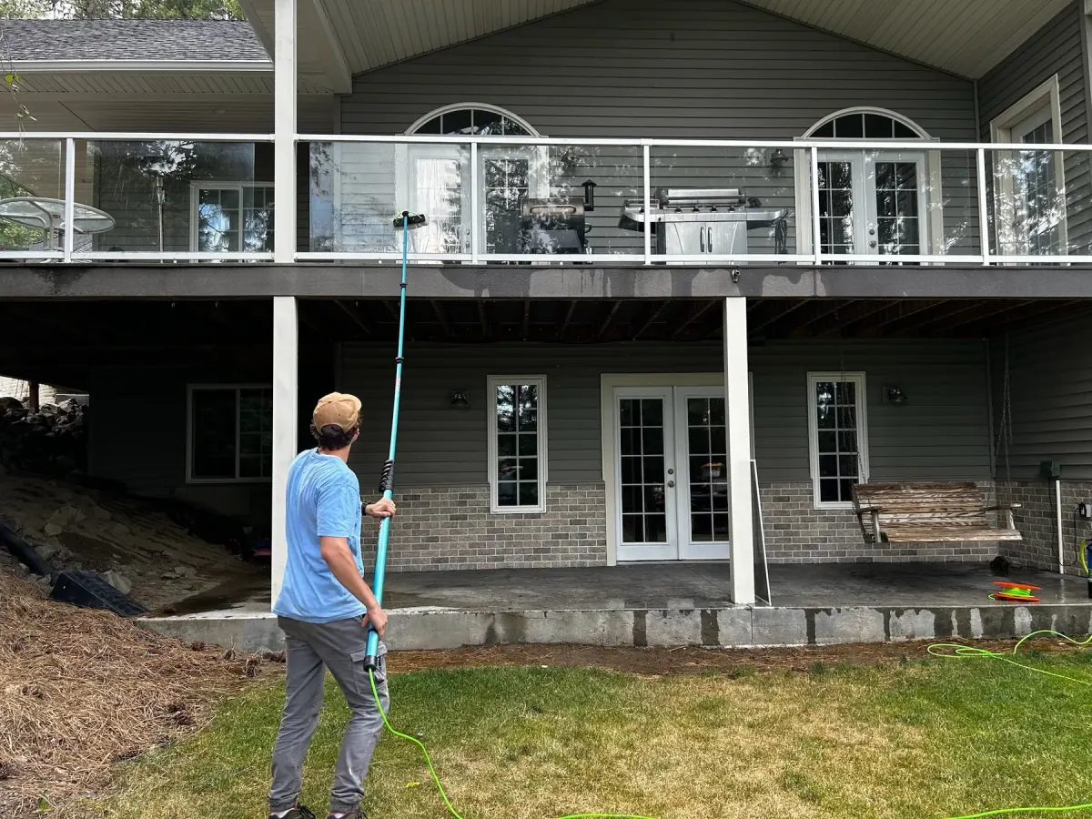 Clearview Window Washing cleaning second-story exterior windows on a Spokane-area home